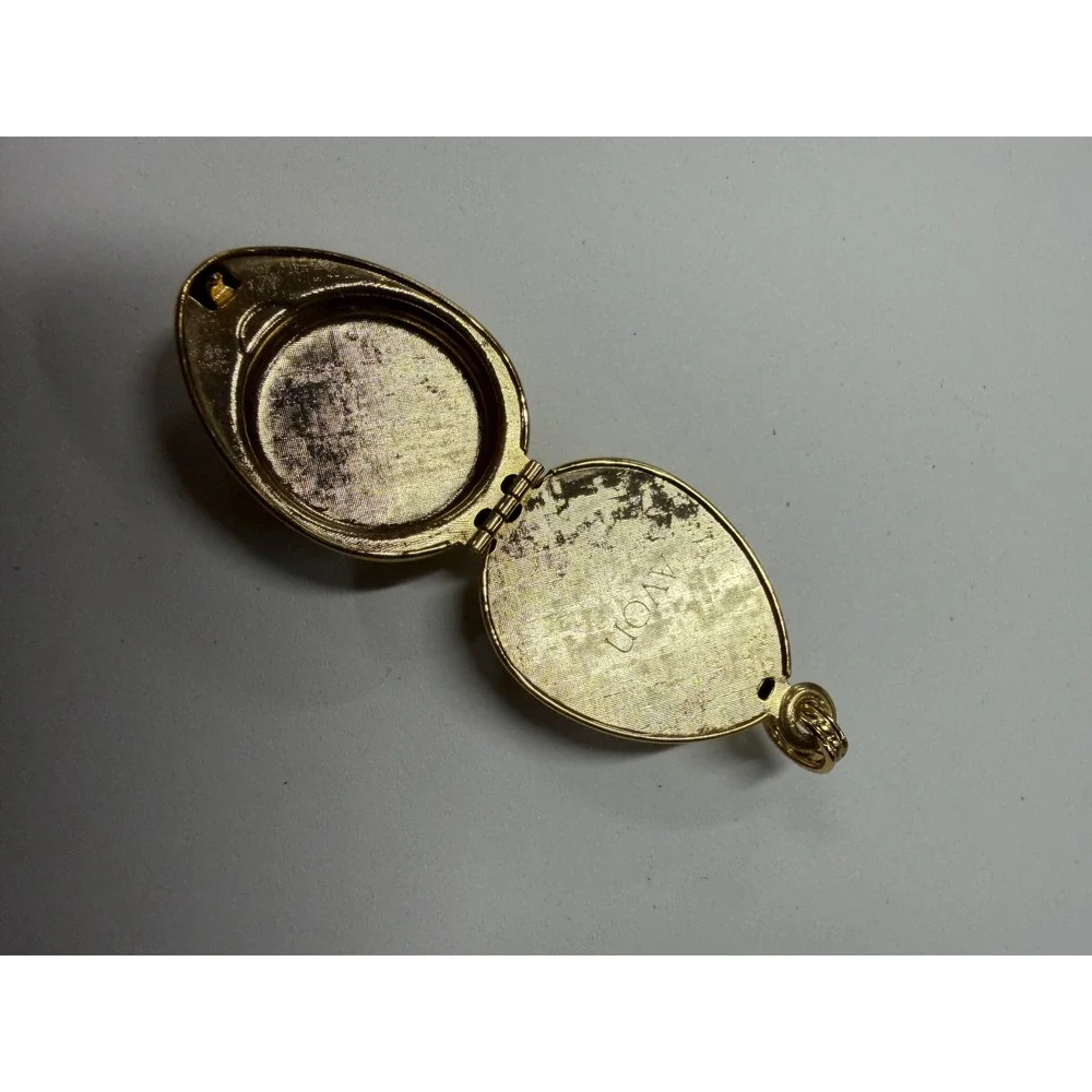 Vintage Avon Gold Tone Egg Locket Pendant Textured Swirl Design Keppsake